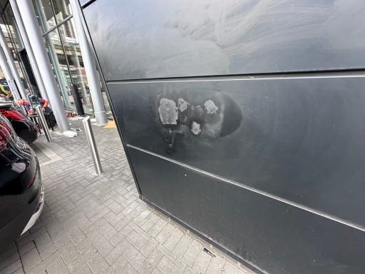 Before smart sales court cladding damaged shopfront panel