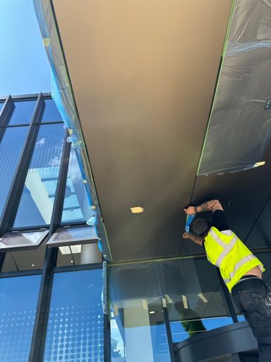 Nottingham university before Cladding repair and spray panel being fixed protection being put up before airbrushing